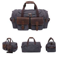 源點(diǎn)帆布旅行包復(fù)古男士手提包休閑耐磨單肩斜跨行李包廠(chǎng)家直銷(xiāo)